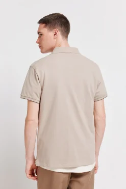 Polo en piqu&eacute; coupe slim &agrave; poignets contrastants