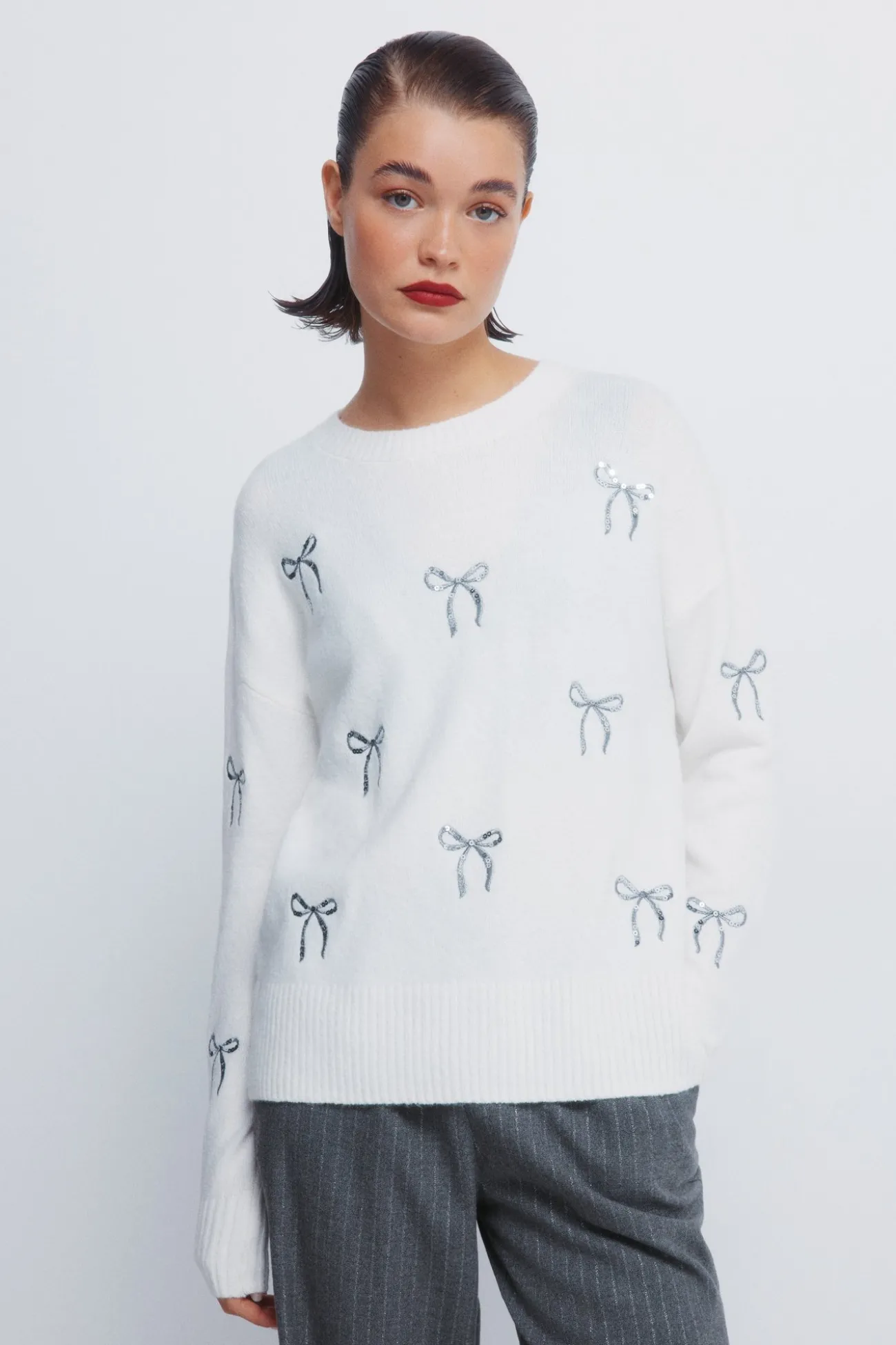 Pull avec nœuds à paillettes